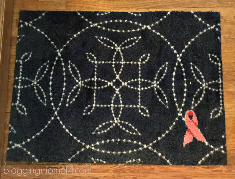 Meet my little shadow - her name is Rosie! She's helping me show off my lovely new Pink Ribbon Welcome Mat from Carpet One. 