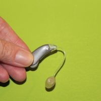 holding hearing aid
