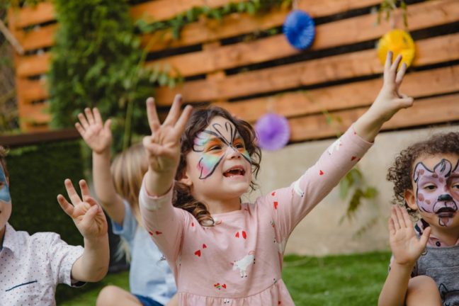 Girl in pink with face painting