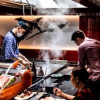 men and woman cooking