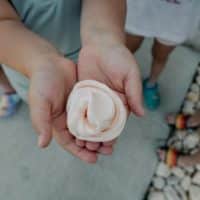 a close up of a person holding something in their hands