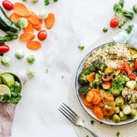 Colorful quinoa salad with fresh vegetables creates a healthy, balanced meal.