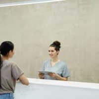 woman speaking to healthcare provider