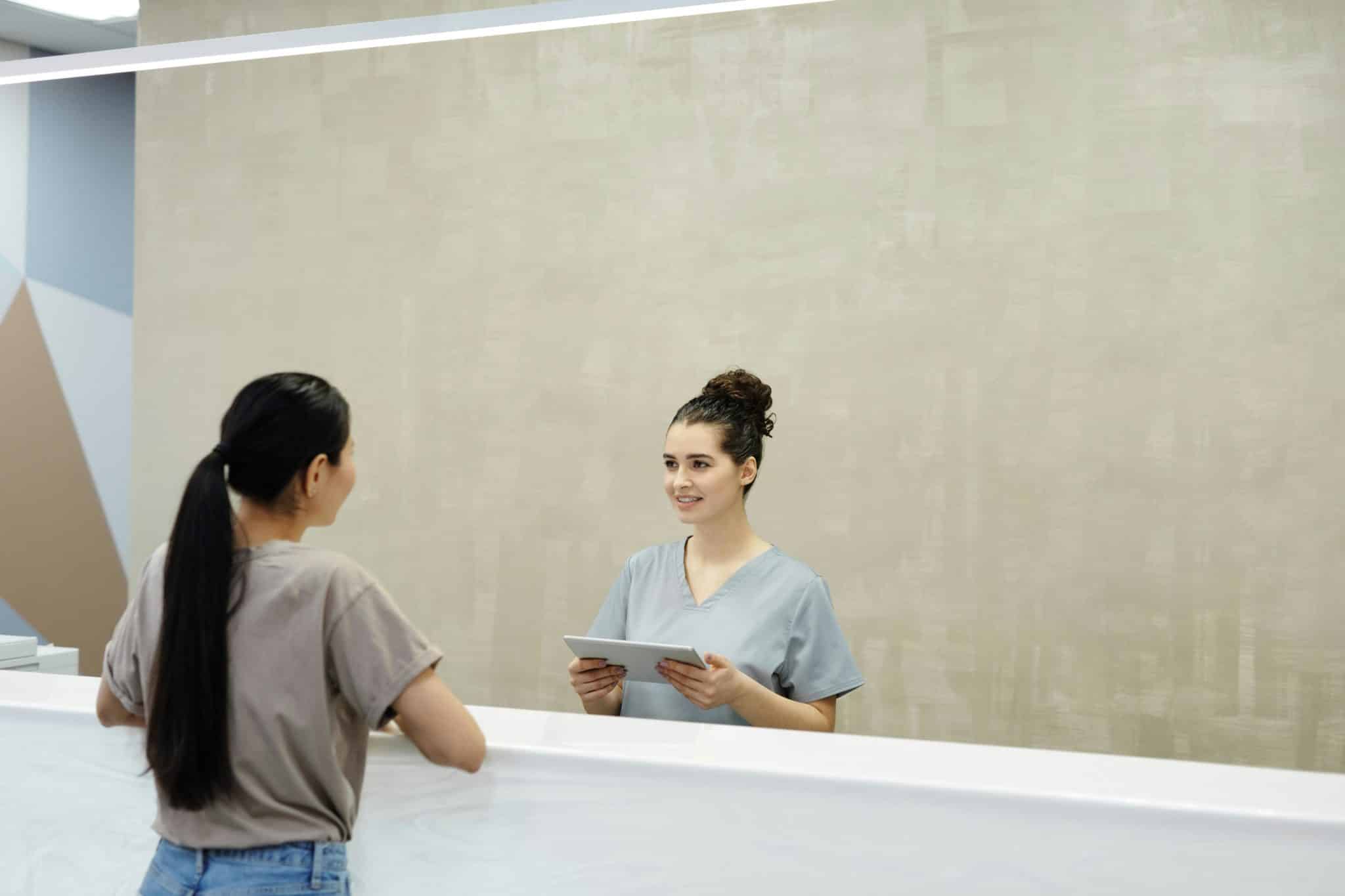 woman speaking to healthcare provider