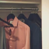 Close-up Photo of Clothes hanging in Wardrobe