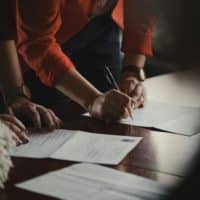 People signing documents for a wedding