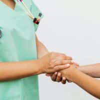 A Doctor and Patient Doing Handshake