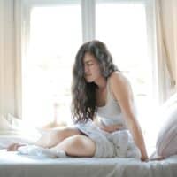 Woman Suffering from a Stomach Pain