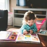 photo of books, book, baby, and reading by Stephen Andrews